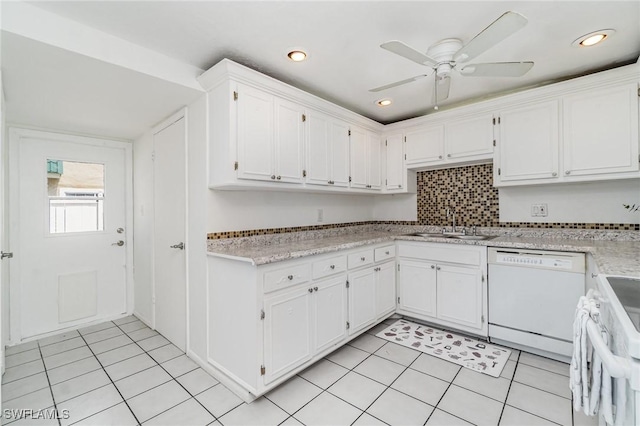 5816 Whiting Ct, Fort Myers, FL 33919 - kitchen with white appliances, a sink, light tile patterned flooring, white cabinetry, and light countertops