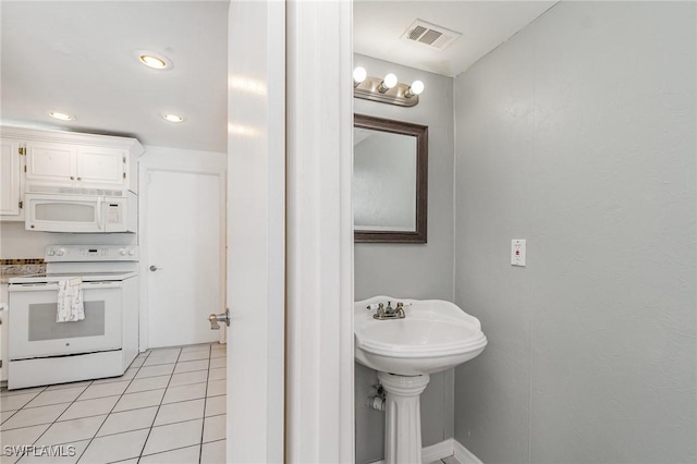 5816 Whiting Ct, Fort Myers, FL 33919 - bathroom with tile patterned floors, recessed lighting, and a sink