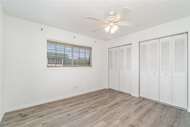 5816 Whiting Ct, Fort Myers, FL 33919 - unfurnished bedroom featuring light wood finished floors, multiple closets, baseboards, and a ceiling fan