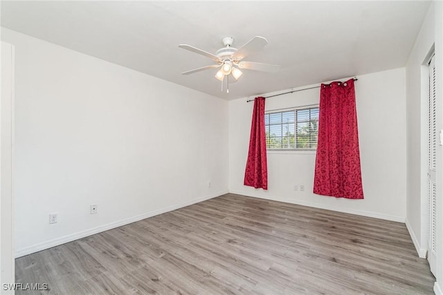 5816 Whiting Ct, Fort Myers, FL 33919 - empty room featuring a ceiling fan, wood finished floors, and baseboards