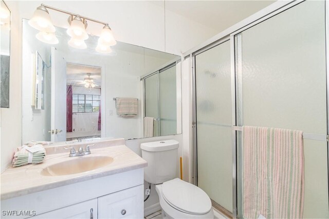 5816 Whiting Ct, Fort Myers, FL 33919 - full bathroom featuring an enclosed shower, vanity, toilet, ensuite bathroom, and ceiling fan