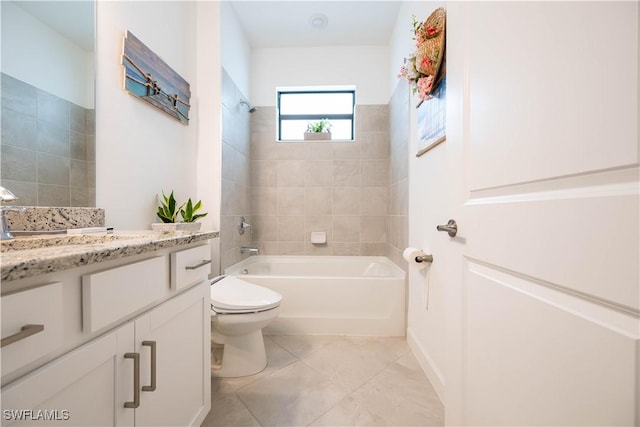 full bath featuring shower / bath combination, toilet, vanity, and tile patterned floors