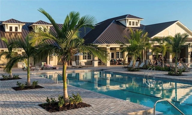 community pool with a patio area