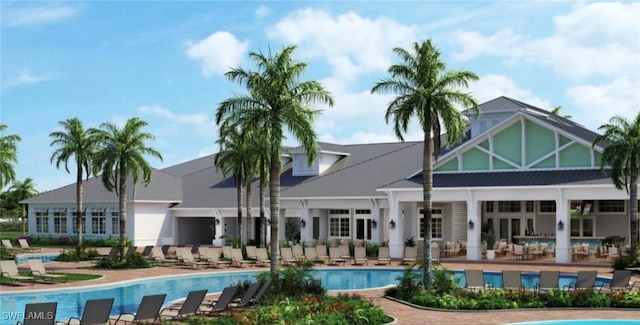 rear view of house featuring a patio and a community pool