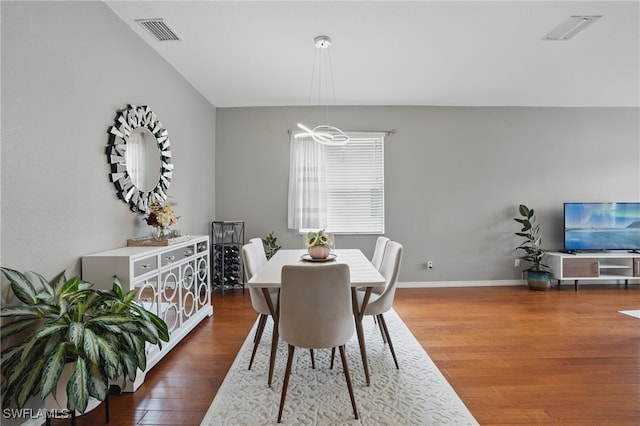 dining room featuring wood finished floors and baseboards