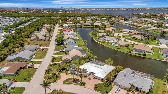 6953 Wittman Dr, Fort Myers, FL 33919 - aerial view of property and surrounding area featuring nearby suburban area and a nearby body of water