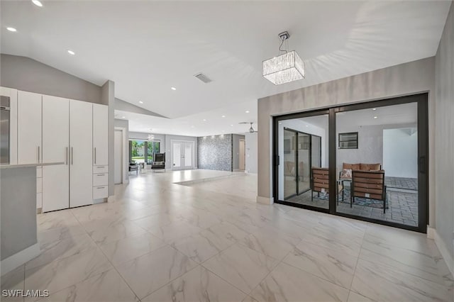 6953 Wittman Dr, Fort Myers, FL 33919 - unfurnished room with vaulted ceiling, a chandelier, recessed lighting, and light marble finish flooring