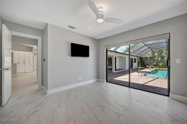 6953 Wittman Dr, Fort Myers, FL 33919 - unfurnished room featuring a sunroom, ceiling fan, baseboards, and marble look tile flooring