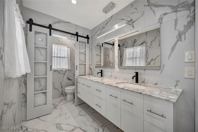 6953 Wittman Dr, Fort Myers, FL 33919 - bathroom featuring toilet, double vanity, marble finish floors, and plenty of natural light