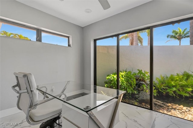 6953 Wittman Dr, Fort Myers, FL 33919 - home office featuring light marble finish flooring and a ceiling fan