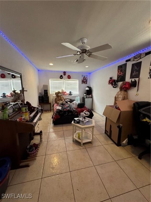 27831 Quinn St, Bonita Springs, FL 34135 - bedroom with light tile patterned floors and ceiling fan