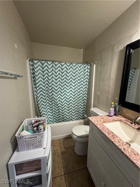 27831 Quinn St, Bonita Springs, FL 34135 - full bathroom with toilet, vanity, tile patterned flooring, a textured wall, and shower / bathtub combination with curtain