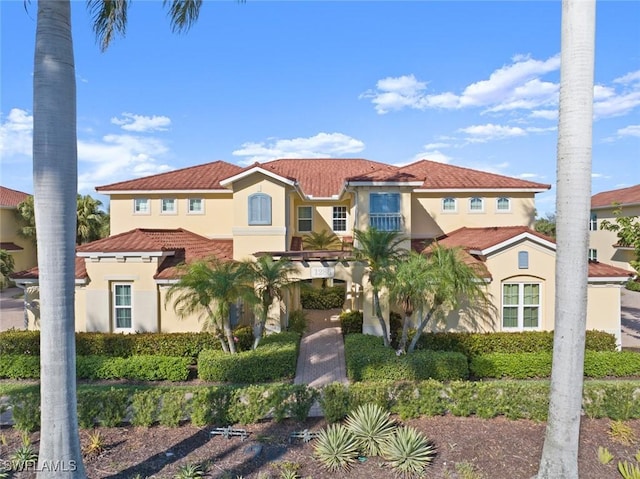 mediterranean / spanish-style house with stucco siding