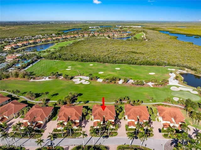 bird's eye view featuring view of golf course, a water view, and a residential view