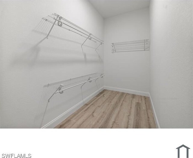 706 Glacier Ave, Lehigh Acres, FL 33974 - walk in closet featuring light wood-style flooring