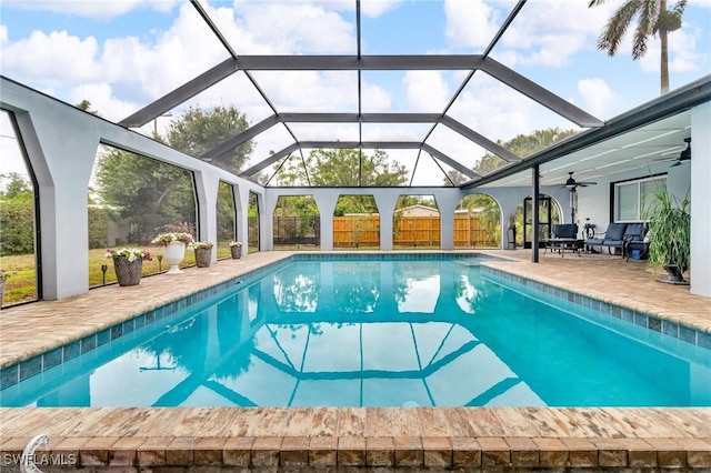 1331 Rio Vista Ave, Fort Myers, FL 33901 - swimming pool featuring ceiling fan, a patio area, glass enclosure, and fence