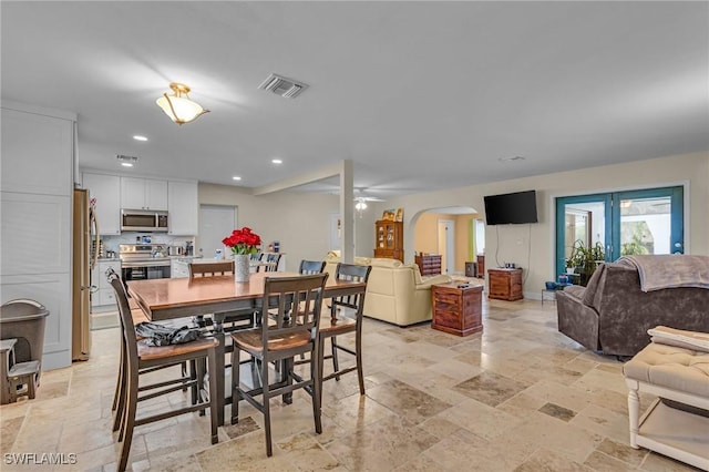 1331 Rio Vista Ave, Fort Myers, FL 33901 - dining room featuring arched walkways, recessed lighting, stone tile floors, and ceiling fan