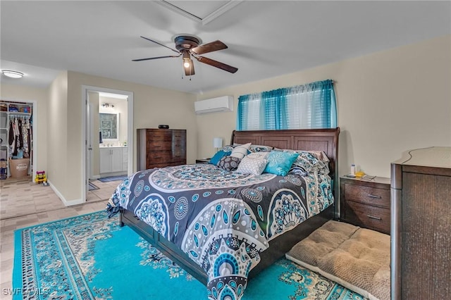 1331 Rio Vista Ave, Fort Myers, FL 33901 - bedroom featuring an AC wall unit, a ceiling fan, baseboards, ensuite bath, and a spacious closet