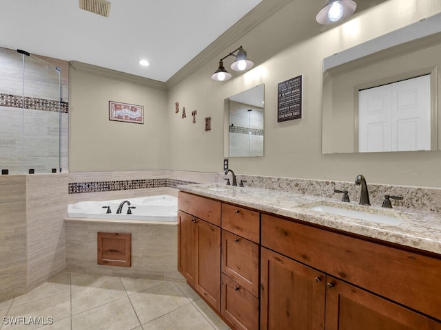 621 NW 28th Ter, Cape Coral, FL 33993 - full bathroom with tile patterned floors, ornamental molding, a garden tub, a tile shower, and double vanity