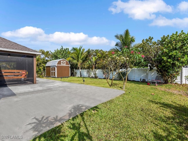 621 NW 28th Ter, Cape Coral, FL 33993 - view of yard featuring a shed, an outdoor structure, a patio, and a sunroom