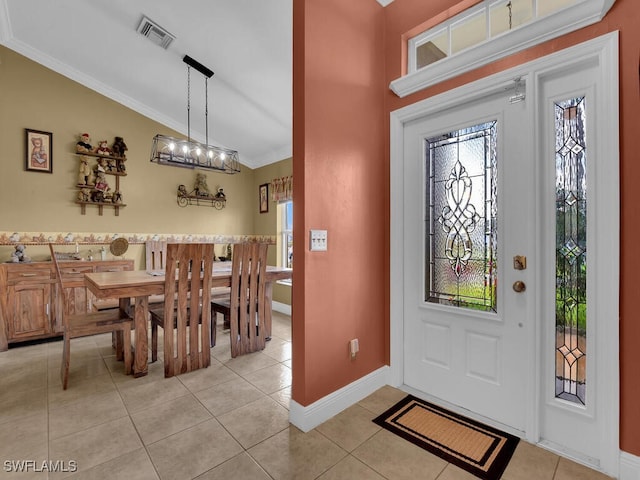 621 NW 28th Ter, Cape Coral, FL 33993 - entrance foyer featuring crown molding, light tile patterned flooring, and baseboards
