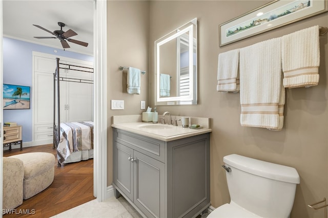 1520 Star Point Ln Unit 4-401, Naples, FL 34112 - bathroom with ceiling fan, toilet, vanity, ensuite bath, and baseboards