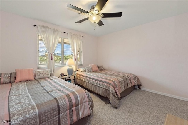 bedroom with baseboards, ceiling fan, and carpet floors