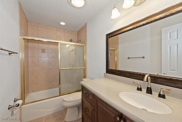 full bathroom with enclosed tub / shower combo, vanity, toilet, and tile patterned flooring