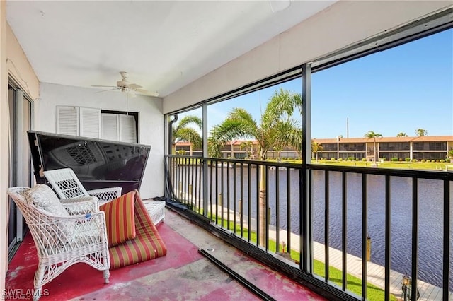 4722 SE 1st Pl Unit 12, Cape Coral, FL 33904 - sunroom featuring a ceiling fan and a water view