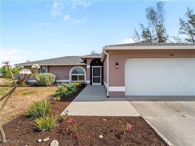 507 NE 31st St, Cape Coral, FL 33909 - single story home with concrete driveway, stucco siding, and a garage