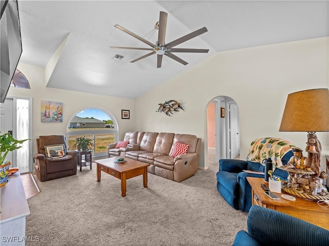 507 NE 31st St, Cape Coral, FL 33909 - carpeted living area with ceiling fan, visible vents, lofted ceiling, and arched walkways