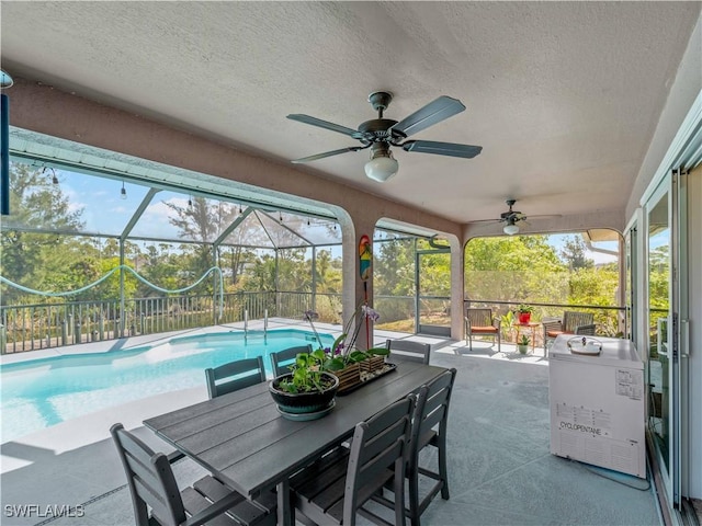 507 NE 31st St, Cape Coral, FL 33909 - view of patio featuring ceiling fan, outdoor dining space, glass enclosure, and an outdoor pool