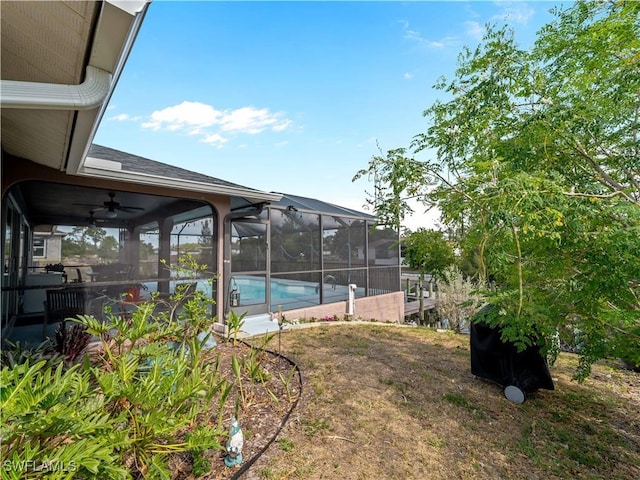 507 NE 31st St, Cape Coral, FL 33909 - view of yard featuring a ceiling fan, an outdoor pool, and glass enclosure