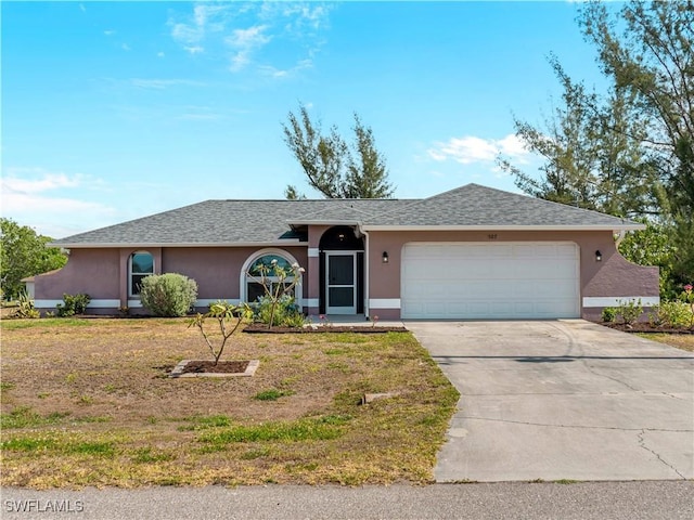 507 NE 31st St, Cape Coral, FL 33909 - single story home with a garage, stucco siding, a front lawn, and driveway