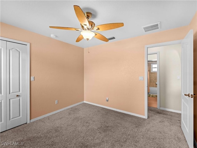 507 NE 31st St, Cape Coral, FL 33909 - unfurnished bedroom with baseboards, a ceiling fan, visible vents, and carpet
