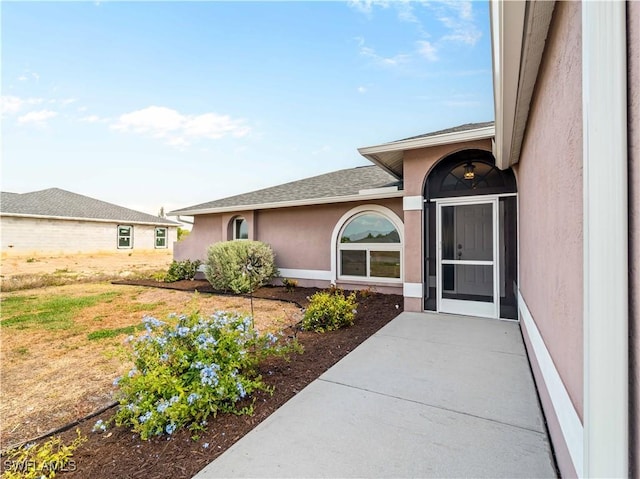 507 NE 31st St, Cape Coral, FL 33909 - entrance to property featuring stucco siding and roof with shingles