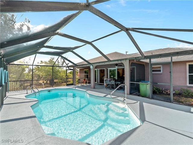 507 NE 31st St, Cape Coral, FL 33909 - outdoor pool featuring a patio area, a ceiling fan, and glass enclosure