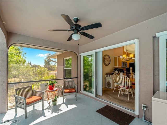 507 NE 31st St, Cape Coral, FL 33909 - sunroom with ceiling fan with notable chandelier