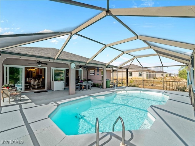 507 NE 31st St, Cape Coral, FL 33909 - pool with a ceiling fan, a patio area, outdoor dining space, and a lanai