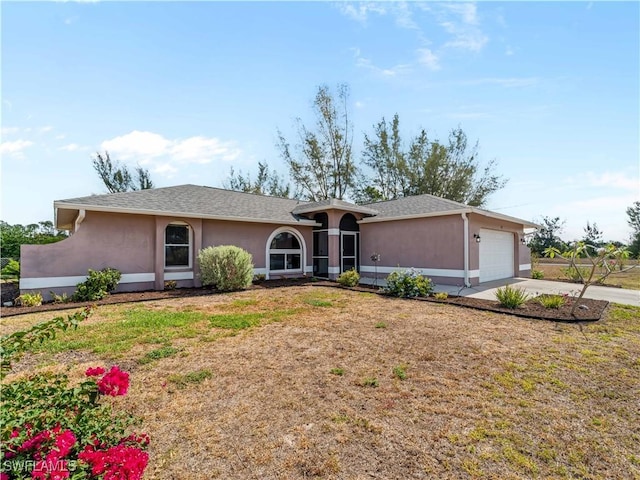 507 NE 31st St, Cape Coral, FL 33909 - single story home featuring a garage, stucco siding, a front lawn, and driveway