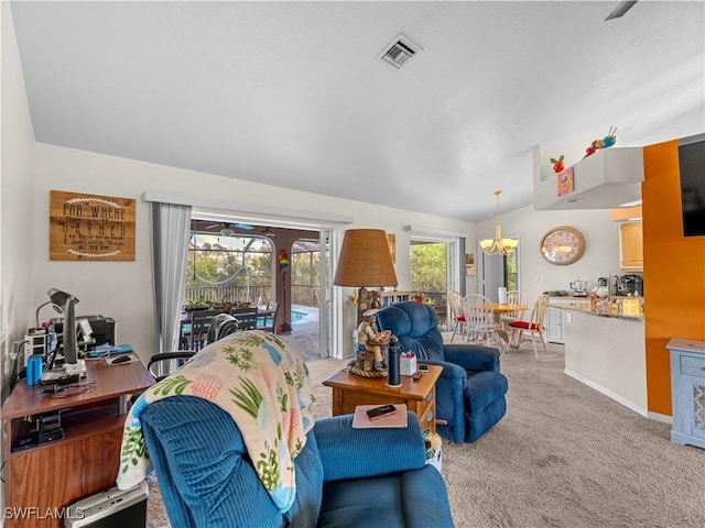 507 NE 31st St, Cape Coral, FL 33909 - carpeted living area with lofted ceiling, baseboards, an inviting chandelier, and visible vents