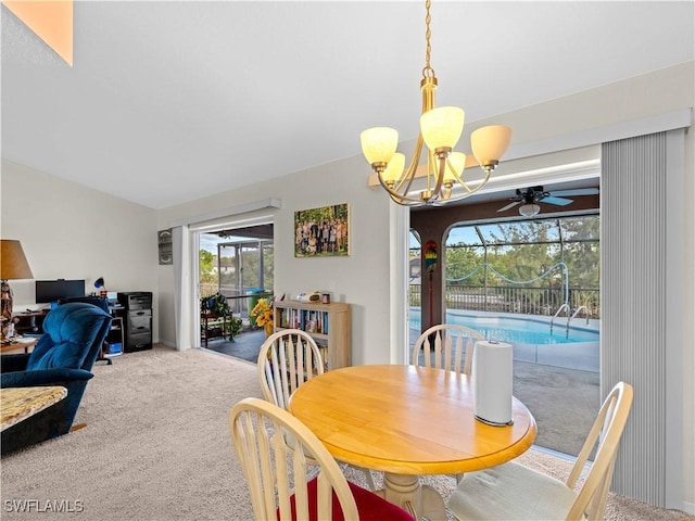 507 NE 31st St, Cape Coral, FL 33909 - carpeted dining space with a wealth of natural light and ceiling fan with notable chandelier