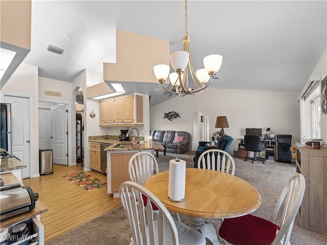 507 NE 31st St, Cape Coral, FL 33909 - dining space featuring a chandelier, visible vents, lofted ceiling, and arched walkways