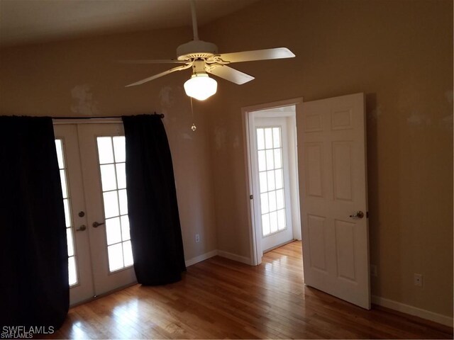 880 18th St NE, Naples, FL 34120 - unfurnished room with ceiling fan, light wood-style flooring, baseboards, and french doors
