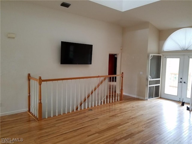 880 18th St NE, Naples, FL 34120 - foyer entrance featuring french doors, wood finished floors, and baseboards