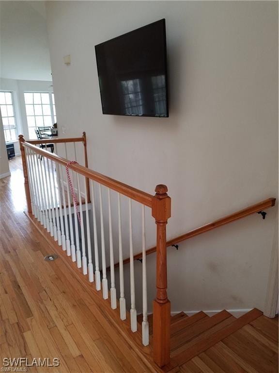 880 18th St NE, Naples, FL 34120 - stairway with baseboards and wood finished floors