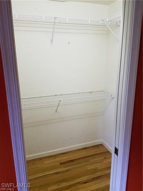 880 18th St NE, Naples, FL 34120 - spacious closet with wood finished floors