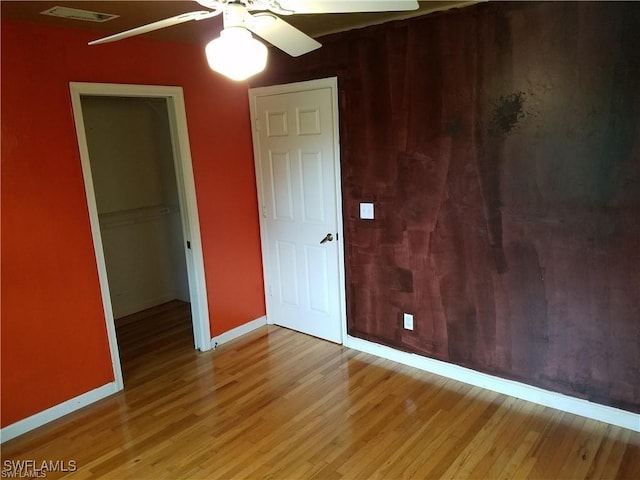 880 18th St NE, Naples, FL 34120 - unfurnished bedroom featuring baseboards, a closet, light wood finished floors, and visible vents