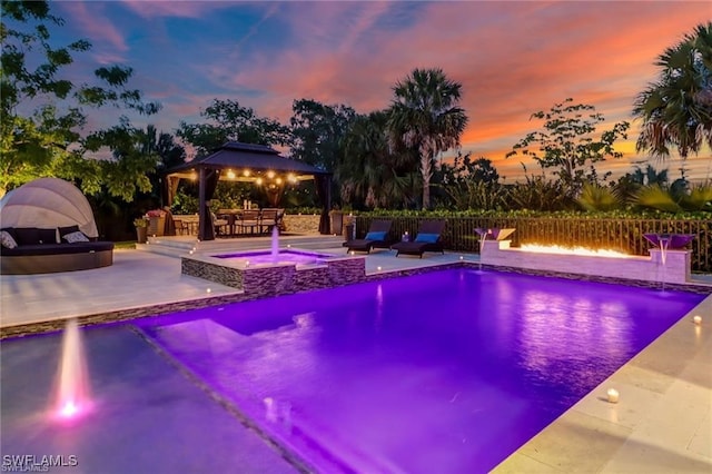 4605 Azalea Dr, Naples, FL 34119 - view of swimming pool with a gazebo, an outdoor fire pit, a patio, and a pool with connected hot tub