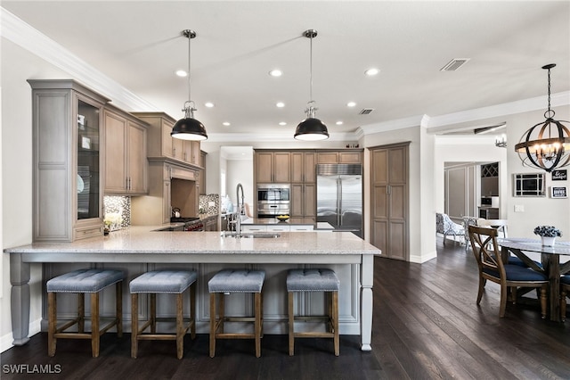 4605 Azalea Dr, Naples, FL 34119 - kitchen with stainless steel appliances, a peninsula, crown molding, a chandelier, and recessed lighting